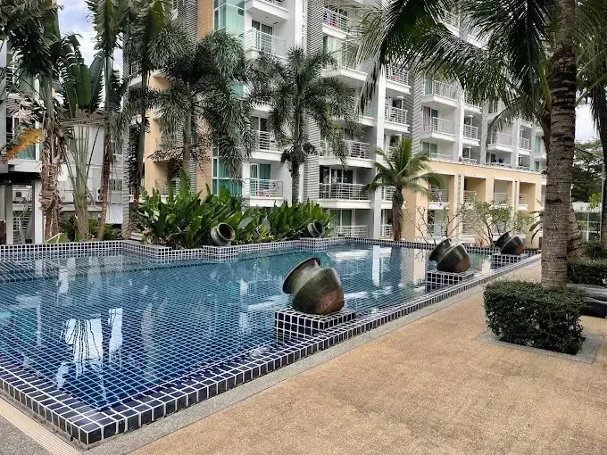 Swimming pool featuring black sphere fountains and spacious sun terraces
